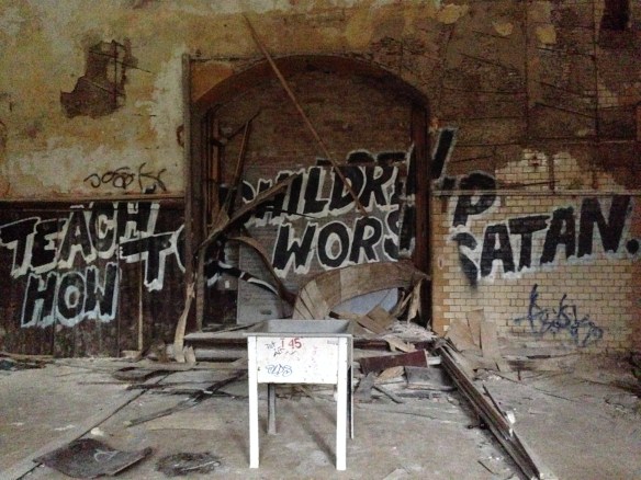 The wall of an old classroom/theater